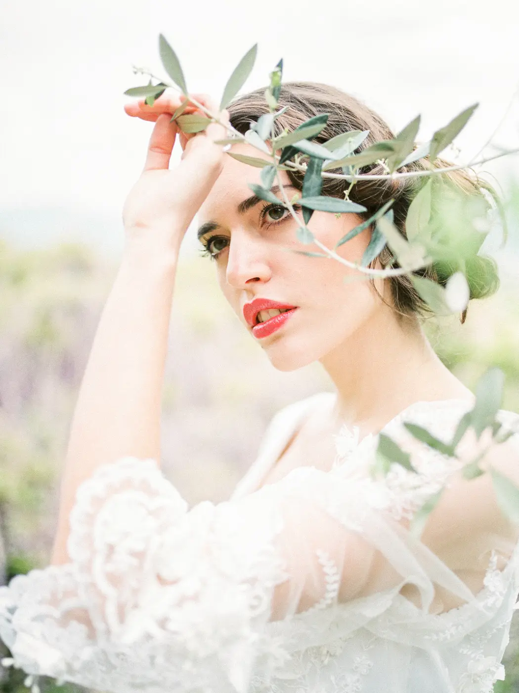 Portrait of the Italian bride with an olive tree
