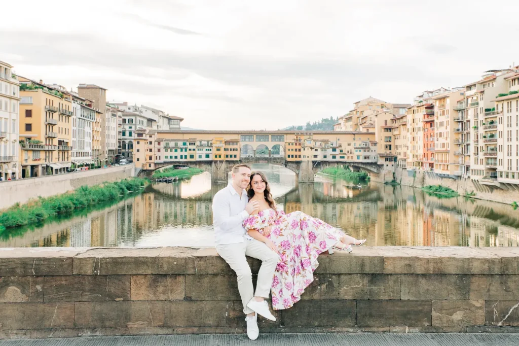 Enchanting view of Ponte Vecchio adds charm to the couple's embrace