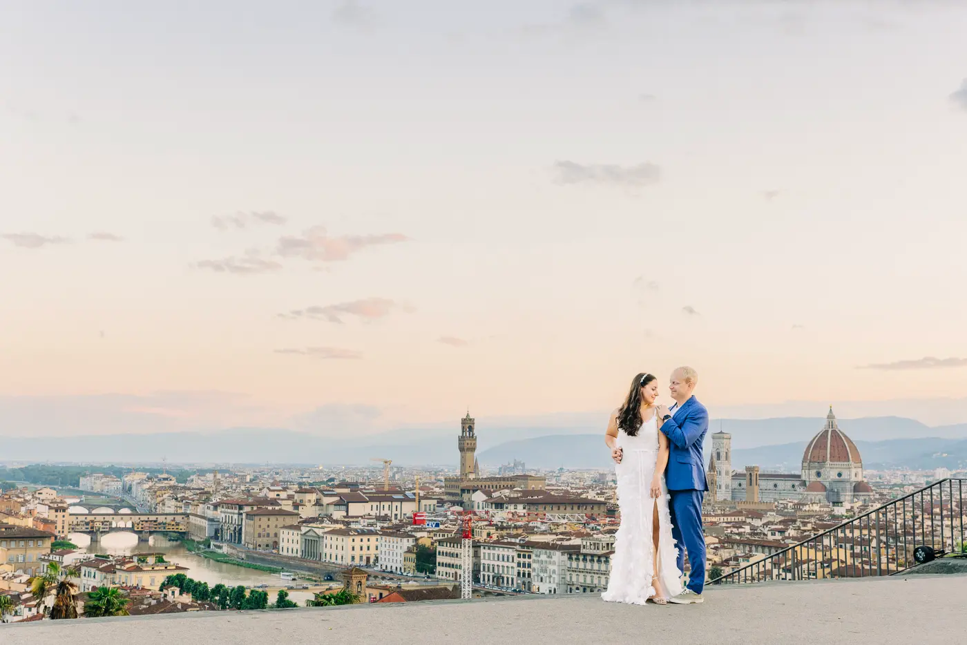 Pre-wedding photo with a Florence overview from Piazzale Michelangelo and flying bird